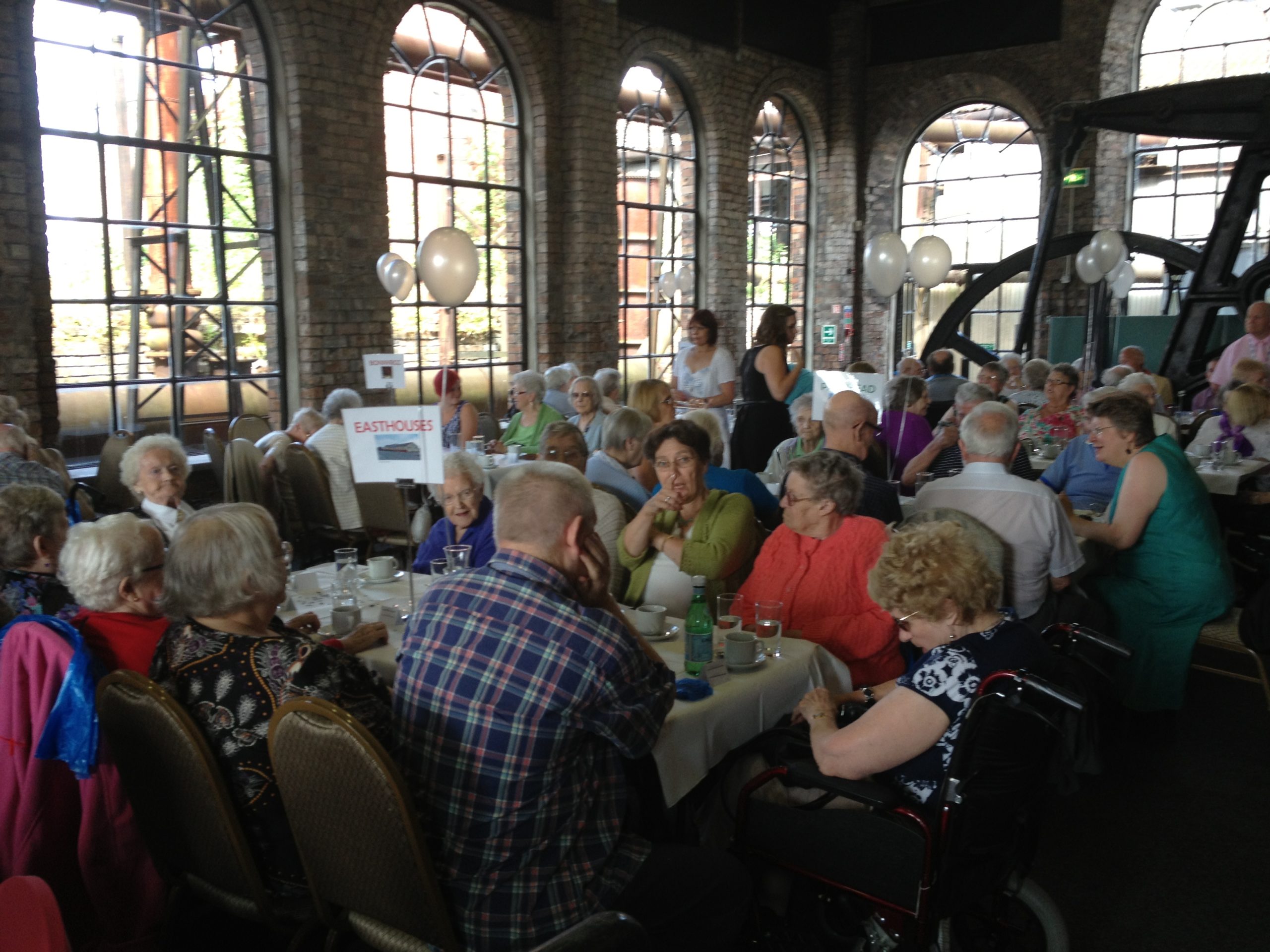 A picture of elderly having a meal celebrating the 25th Anniversary Party of St David's Bradbury Day Centre in Midlothian, a social place for the elderly